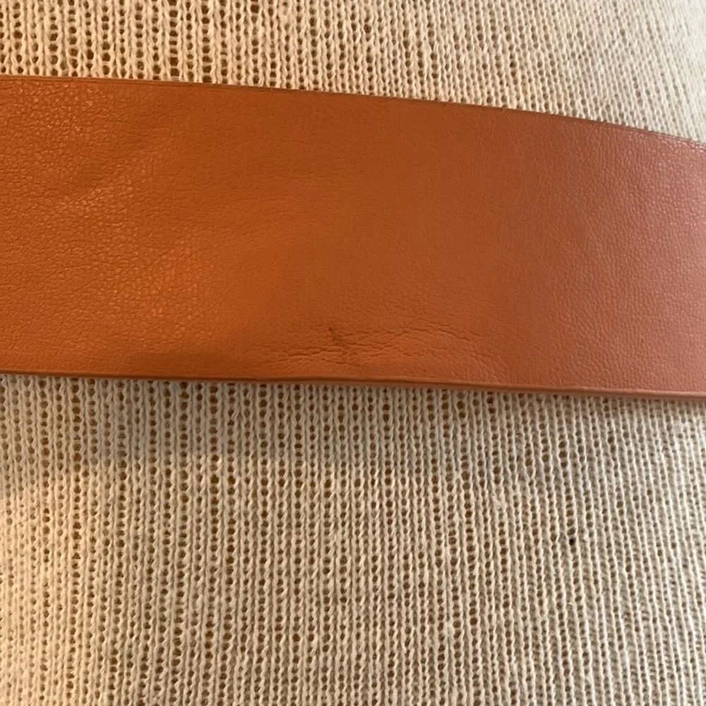 Faux leather peachy tan belt with gold buckle detail